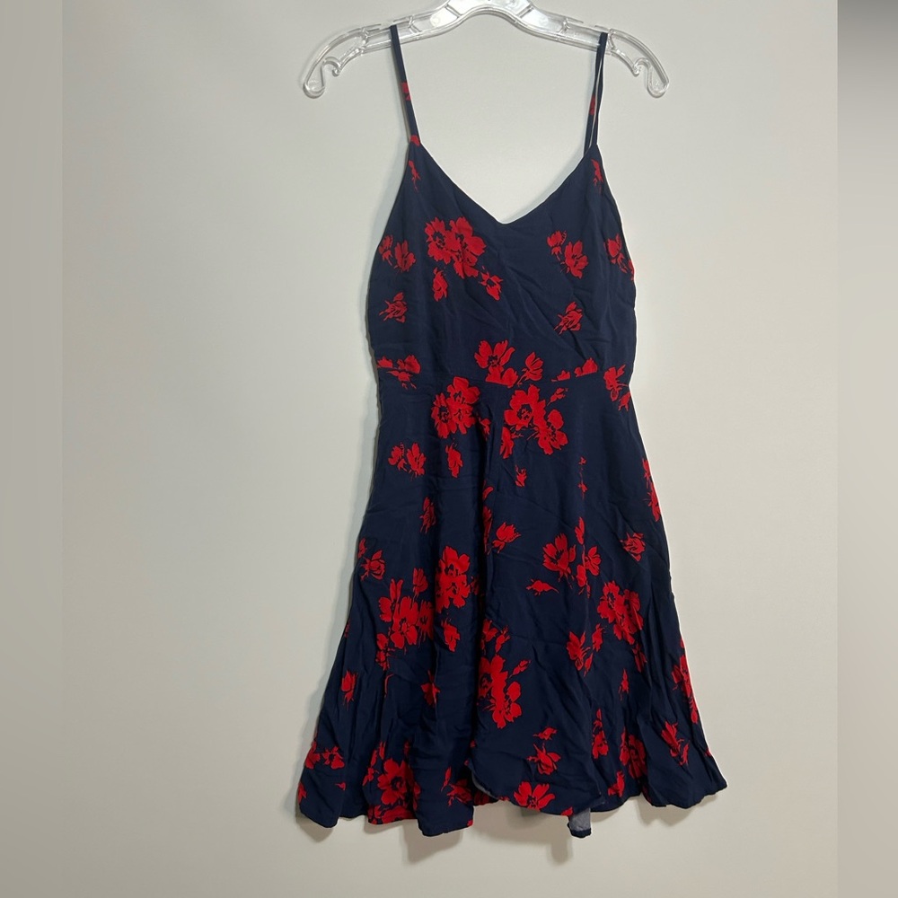 Flowy knee-length dress. Navy blue with red flower pattern.